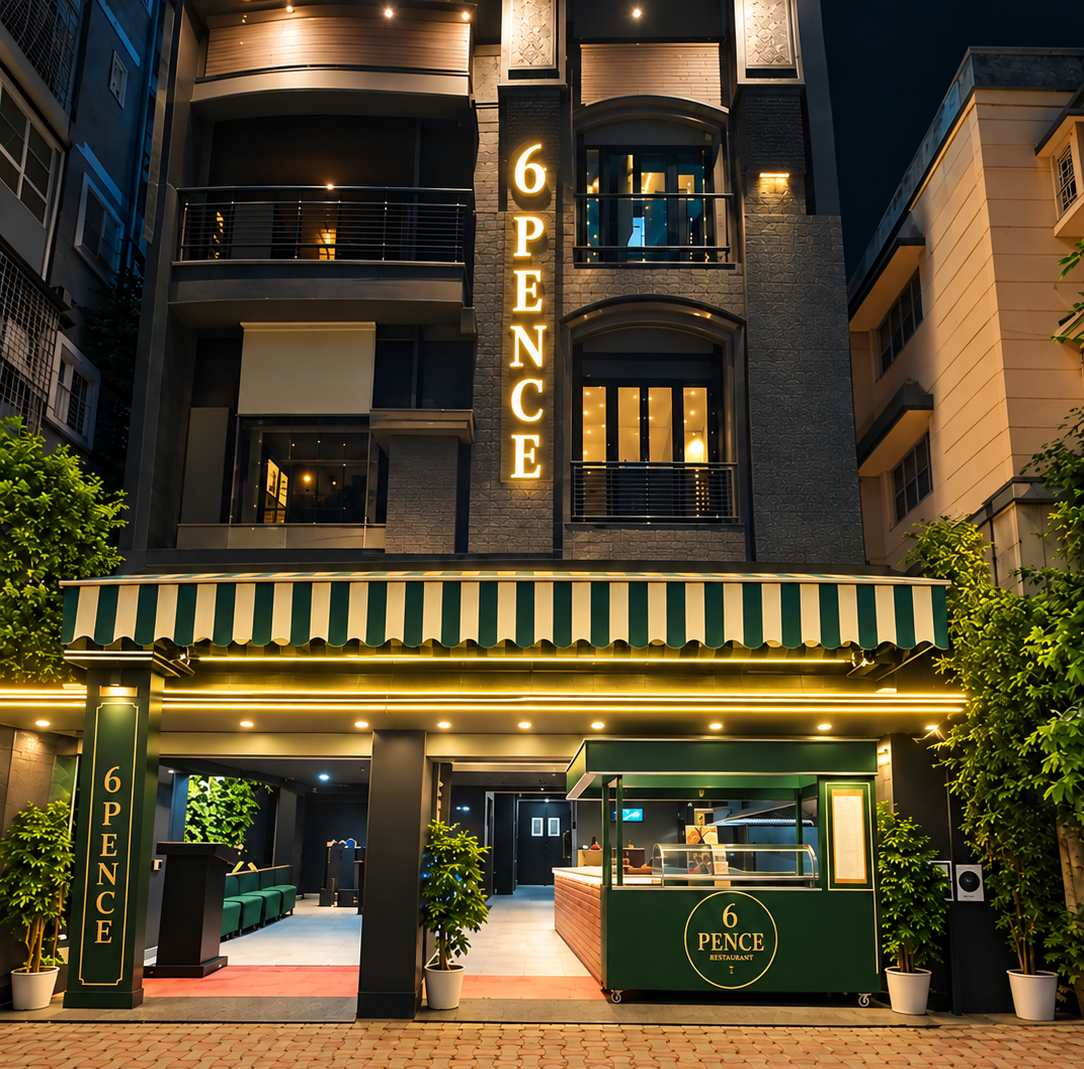 6 Pence Restaurant storefront exterior at night with outdoor seating